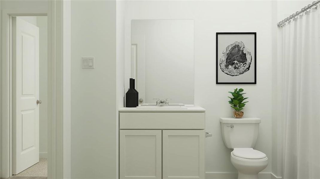 Bathroom with vanity and toilet