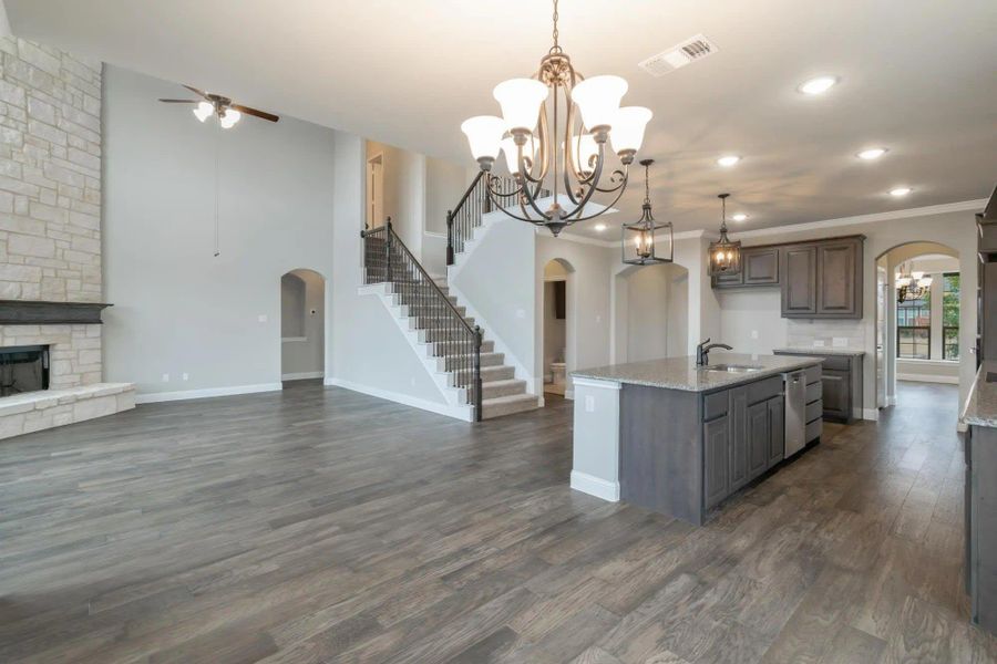 Kitchen to Family Room | Concept 3218 at Belle Meadows in Cleburne, TX by Landsea Homes