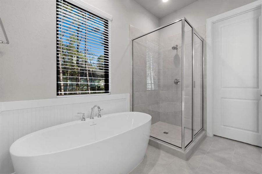 Separate shower and soaking tub.