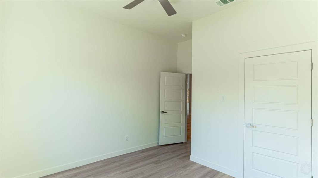 Secondary bedroom with large walk in closet