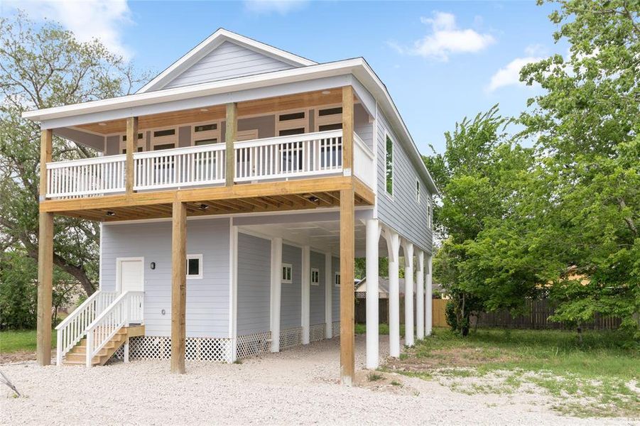 Entrance and parking for boat, trailers, RV.  Has power and water. Extra sturdy with 30' x 13" treated piles 16' friction driven depth. This solid house isn't going anywhere in a storm