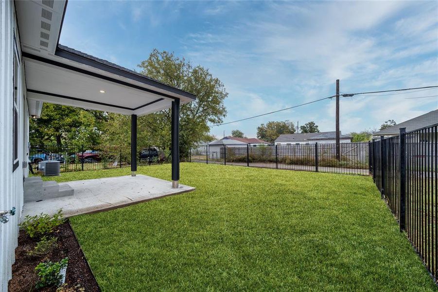 View of yard featuring a patio and central AC