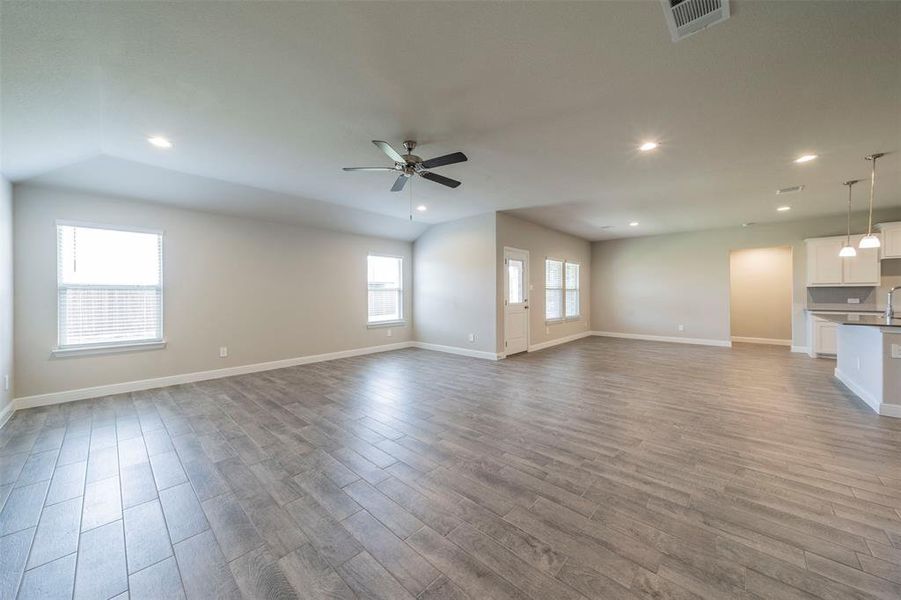 View of living room looking towards the dining space and kitchen