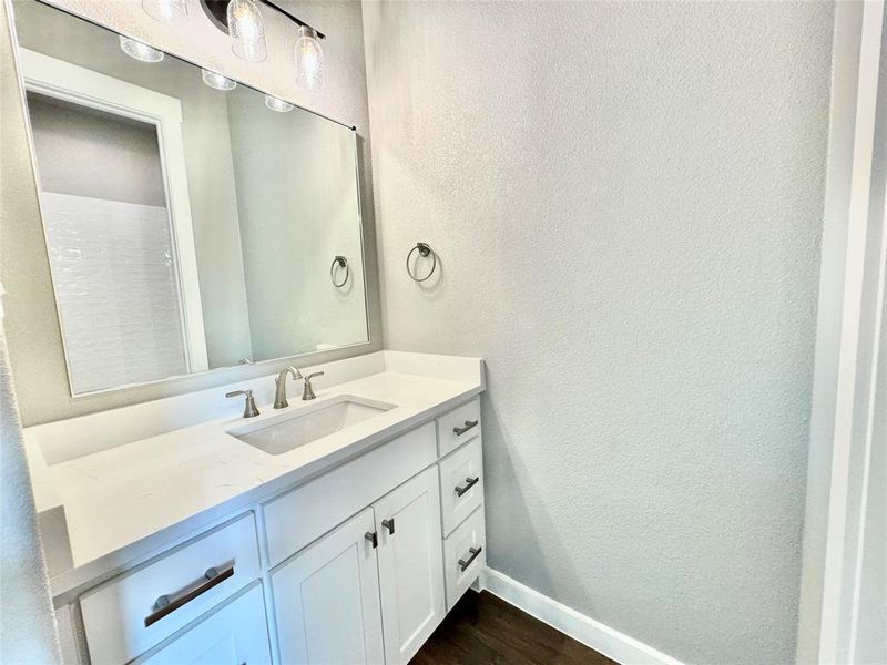 Bathroom featuring vanity and hardwood / wood-style flooring