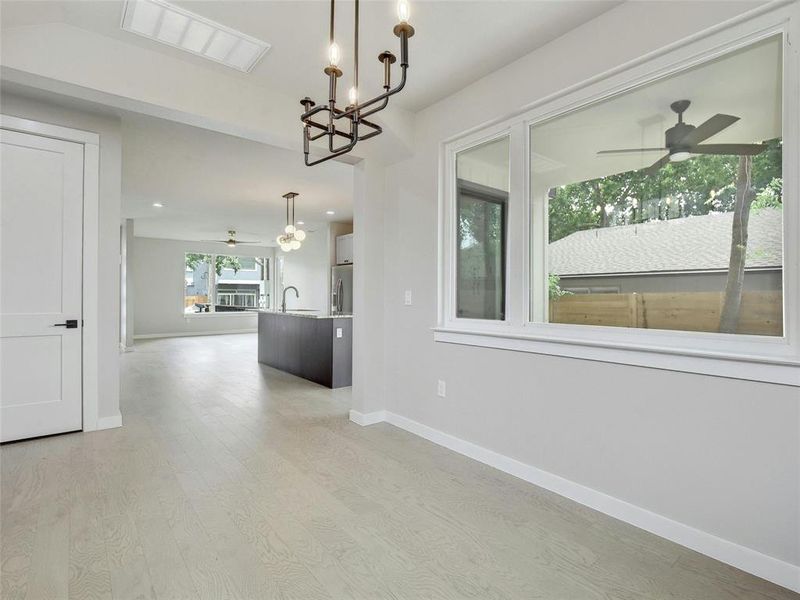 The adjacent dining area is perfect for family meals and entertaining guests, featuring ample space and a seamless connection to the kitchen.