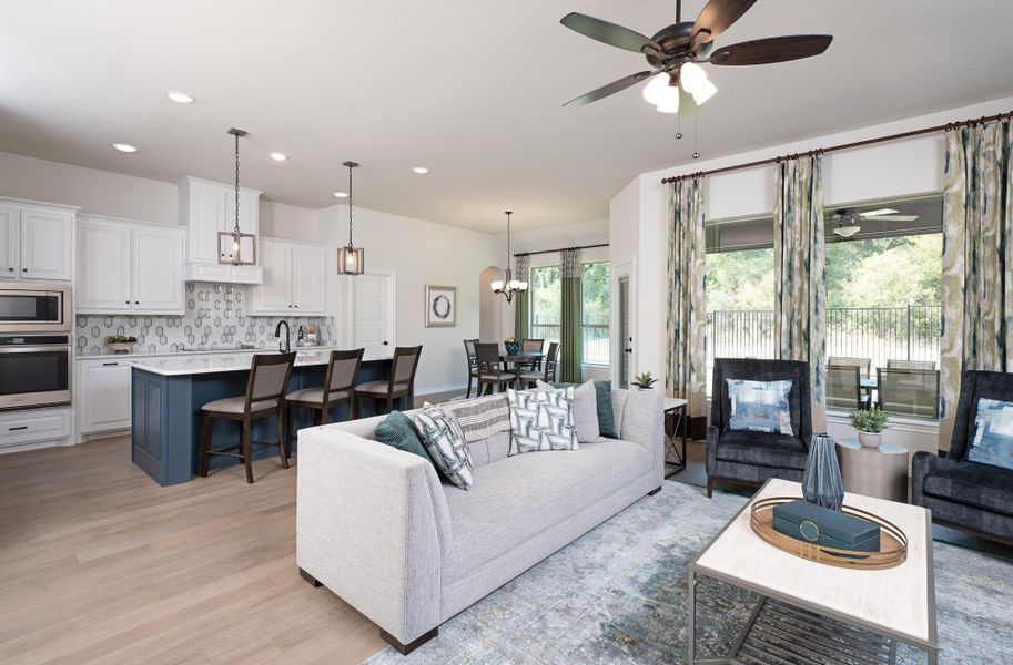 Family Room & Kitchen | Concept 2464 at Lovers Landing in Forney, TX by Landsea Homes