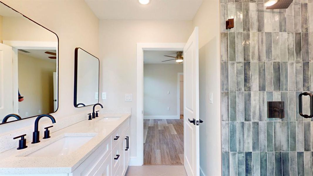 Tile is white in this home. This photo is of model while waiting on updated photography.