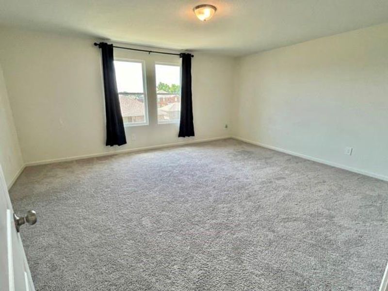 Empty room with carpet floors