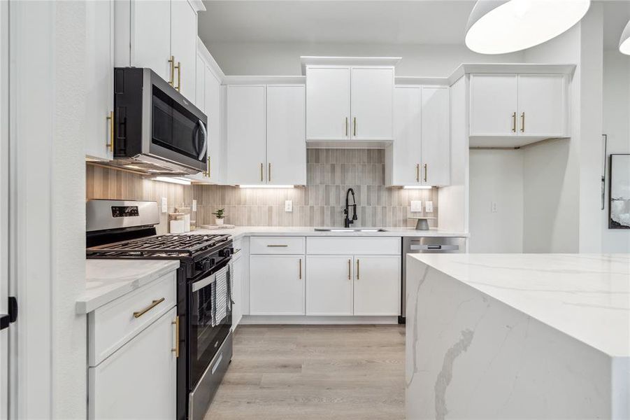 Realize your culinary aspirations in this chef's haven, featuring abundant cabinet space and exquisite design elements. Perfect for crafting gourmet meals with style and ease.