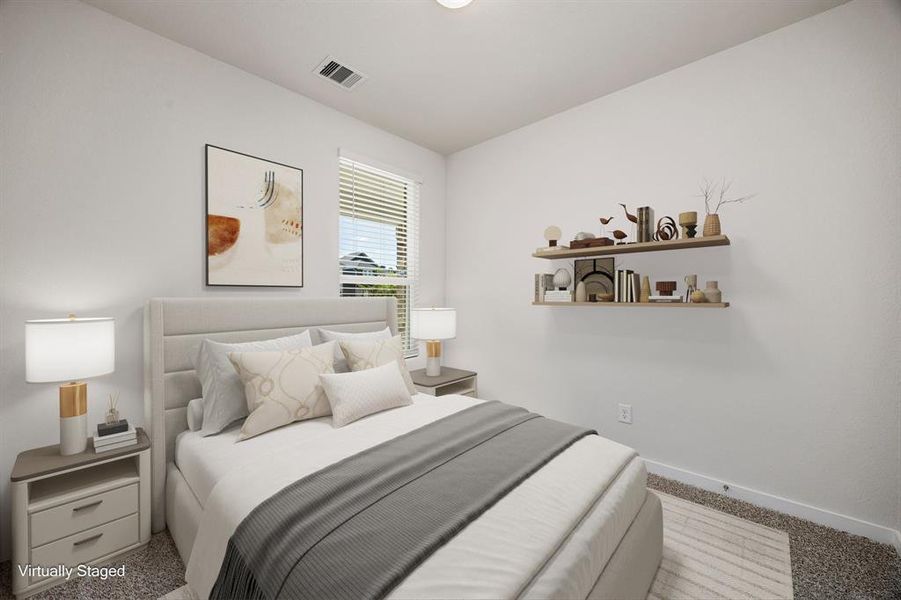 Secondary bedroom features plush carpet, neutral paint, lighting and a large window with privacy blinds and aptly sized closet.