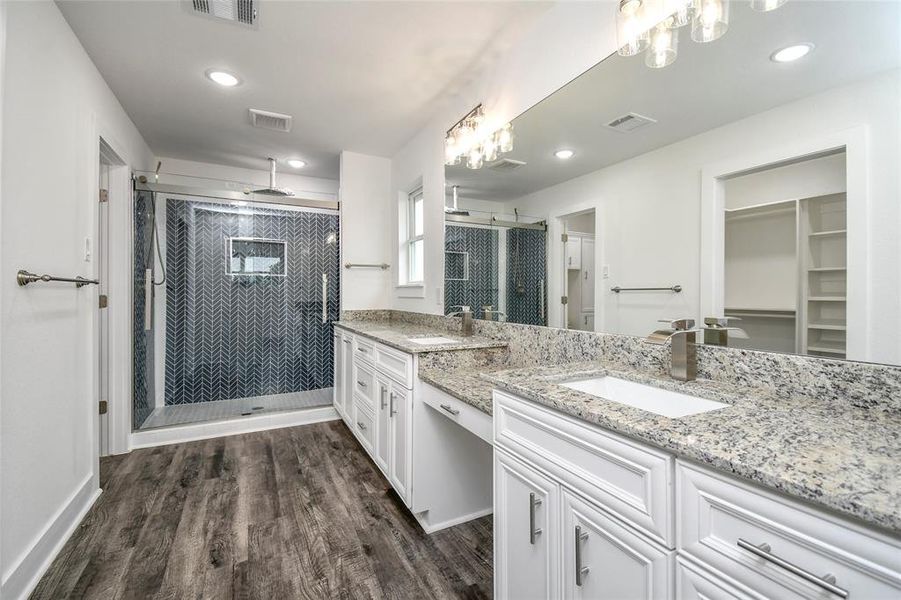 Main bathroom retreat. Double sinks, granite counters, luxurious double shower with a rainfall shower head.