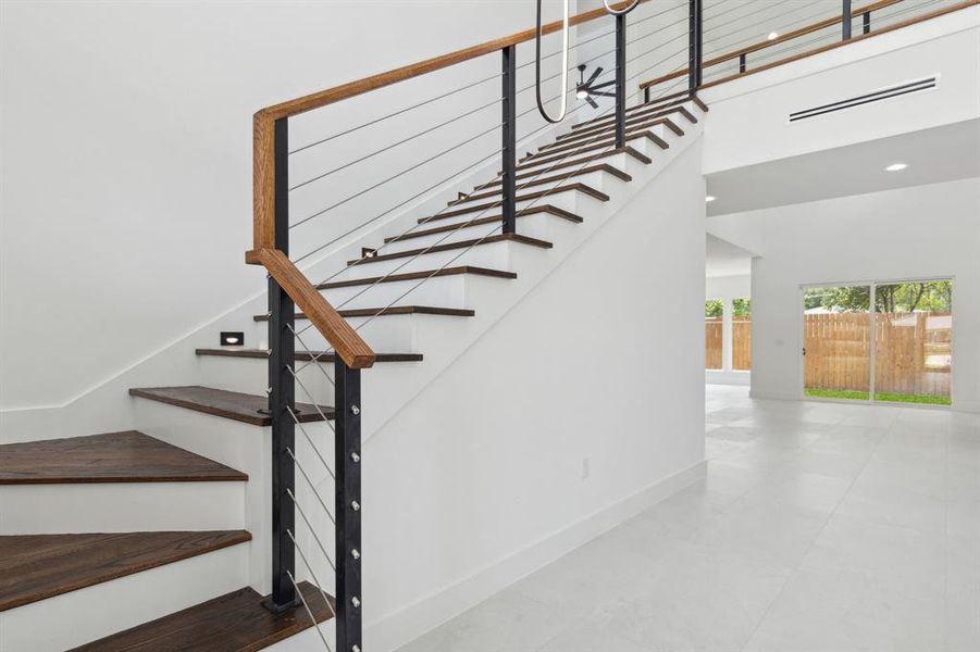 Staircase featuring tile flooring