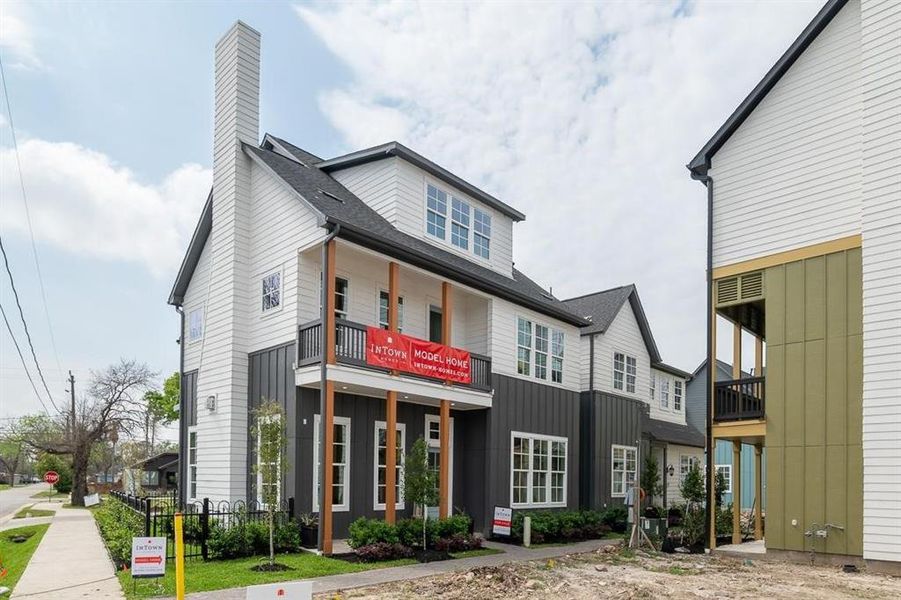 What a grand home with it’s great architecture, front porch and balcony!