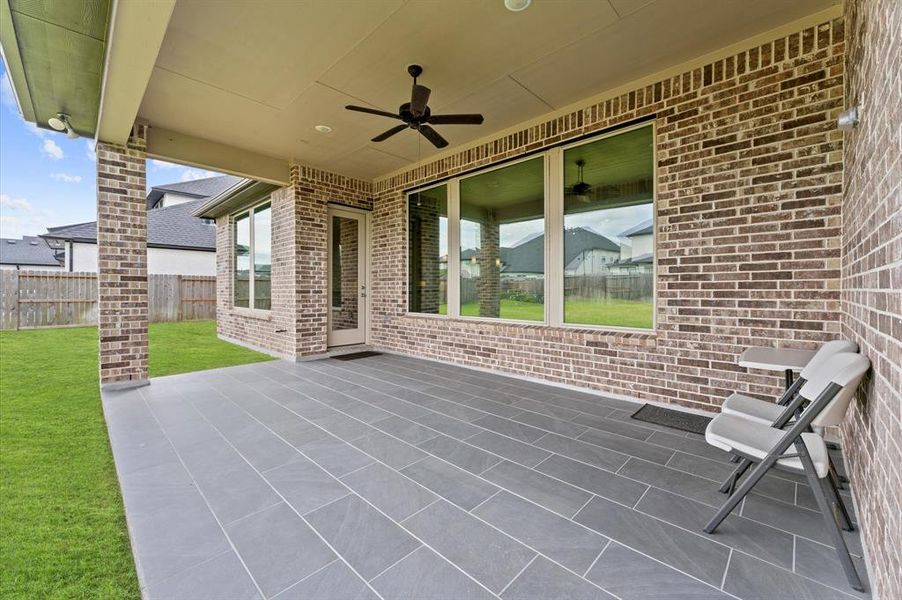 The outdoor space is equally impressive, with a covered patio that’s perfect for al fresco dining or relaxing in the shade.