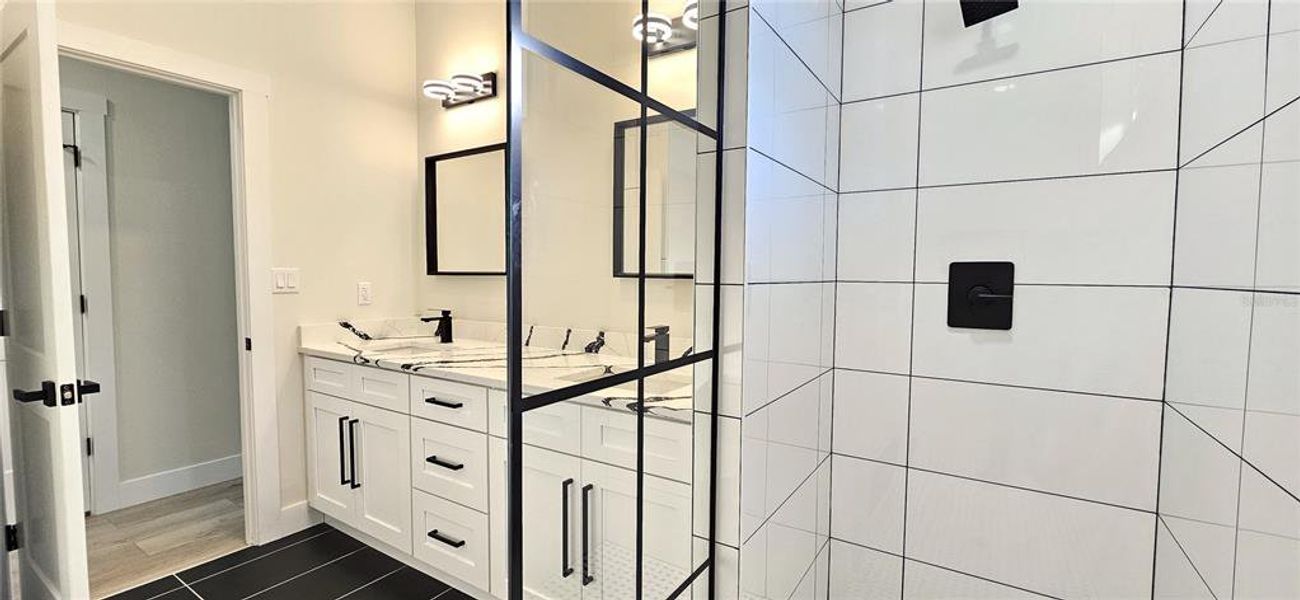 Tiled shower and decorative divider