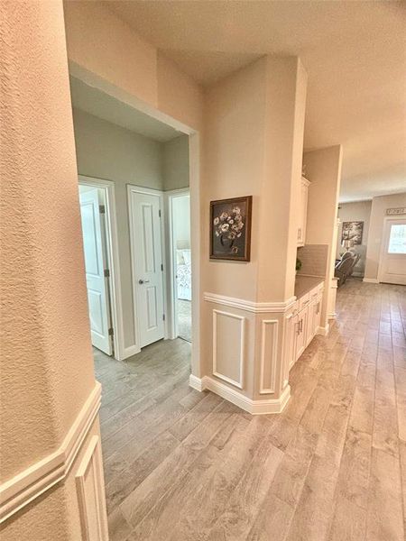 Hallway featuring light hardwood / wood-style flooring