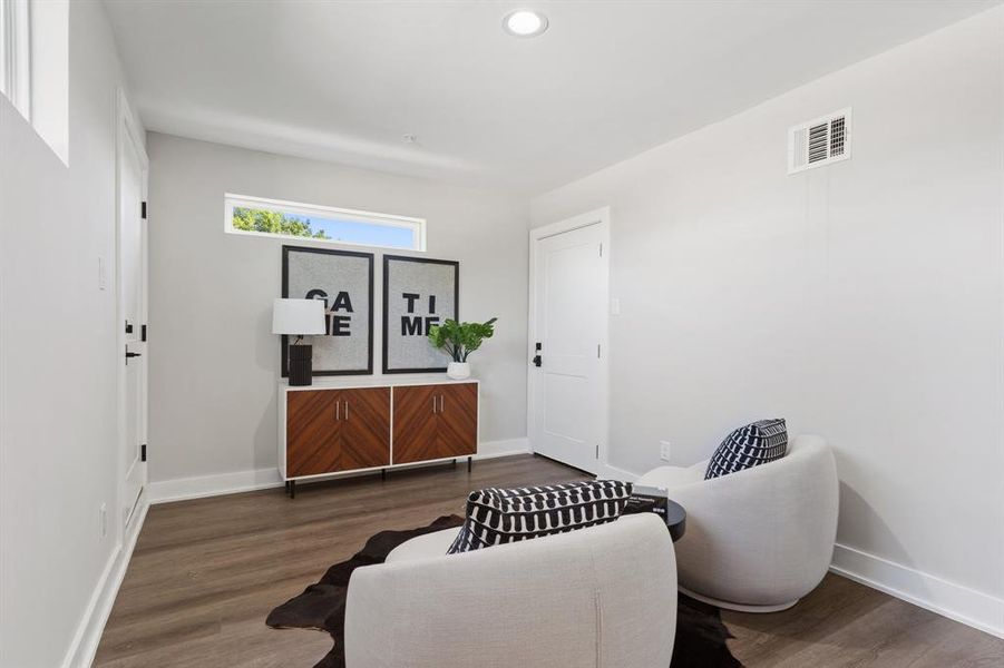 Sitting room featuring dark hardwood / wood-style floors