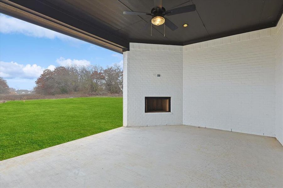 View of patio featuring ceiling fan