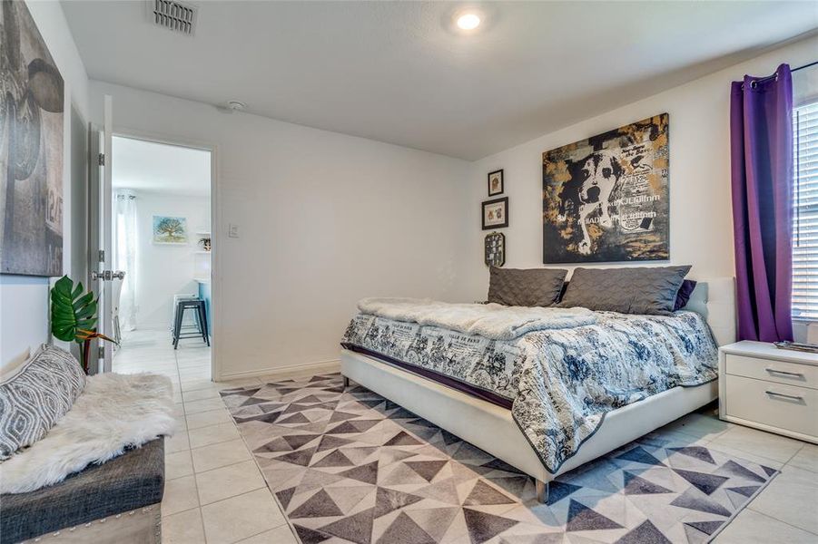 Primary Bedroom featuring light tile patterned floors