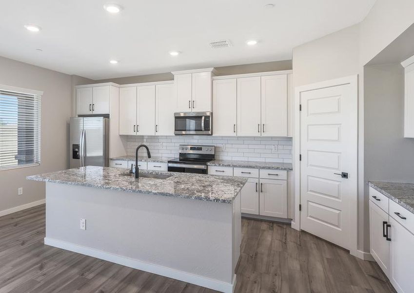 The kitchen serves as the perfect spot for making memories through cooking.