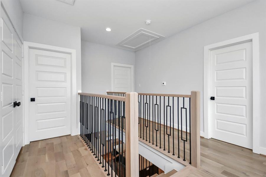 The stairway features a wonderful geometric design and leads to the upstairs landing, the utility area, the primary suite and the two secondary bedrooms which directly connect to the secondary full bathroom!