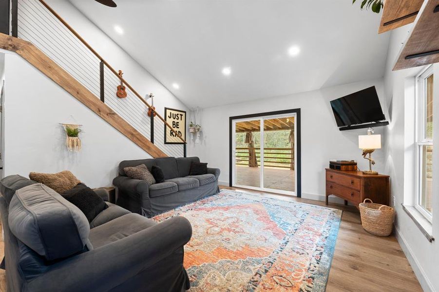 Inviting sliding glass door leading to the porch with a view of the woods