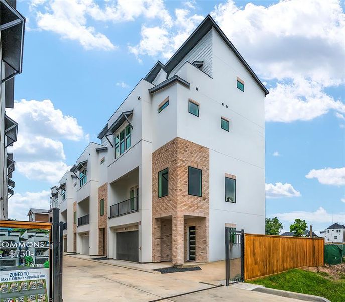 Vele Commons is a brand new construction and gated community in Spring Branch. Unit D is the four-story unit on the far end.