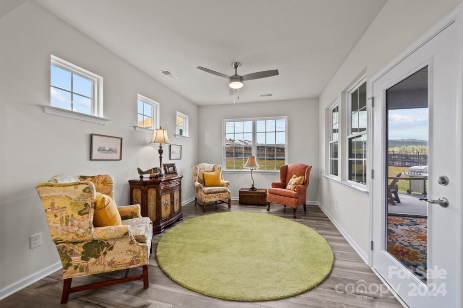 Totally adaptable room open to the heartbeat of this home, yet tucked away off the main space.  Make it formal with room for a large dining area, or relax in your favorite overstuffed chairs.  Notice all the windows positioned for light and privacy.   Opens directly to large screened porch.