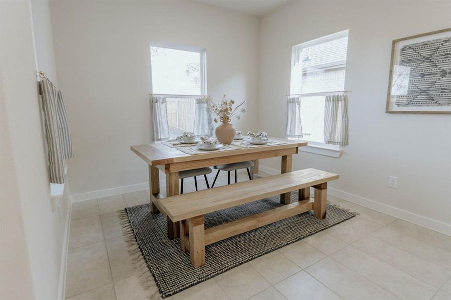 Dining room with light tile patterned floors