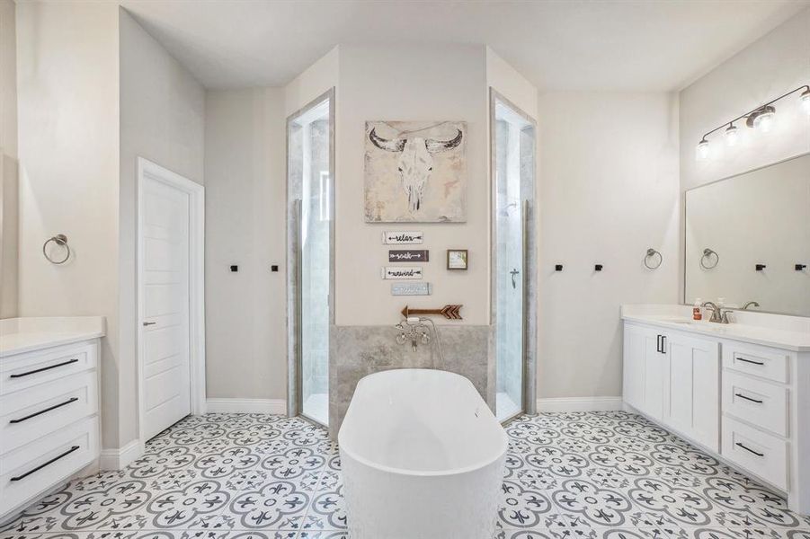 Bathroom with vanity, shower with separate bathtub, and tile patterned flooring