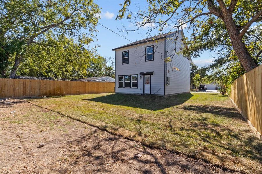 The backyard boasts fresh sod and a newly installed fence, making it a perfect space for outdoor activities and relaxation.