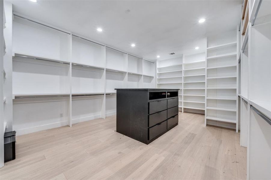 Spacious closet with light wood-type flooring