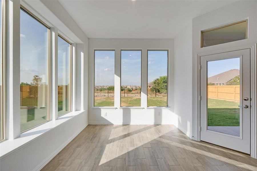 Unfurnished sunroom with a wealth of natural light