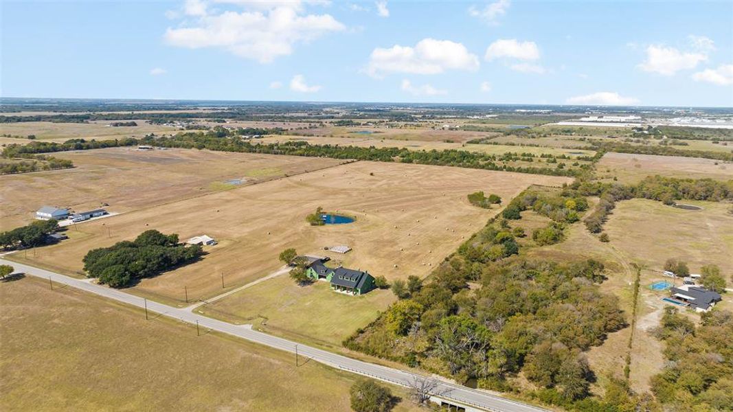 Birds eye view of property with a rural view