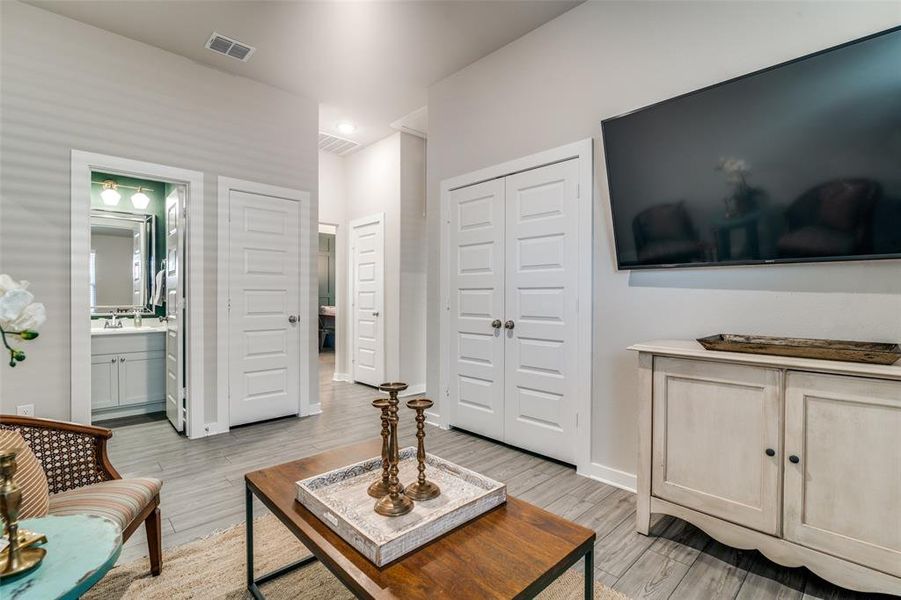 Living room featuring light hardwood / wood-style flooring and sink