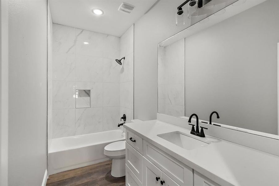 This third guest bathroom combines style and functionality, offering a comfortable and inviting space for guests.