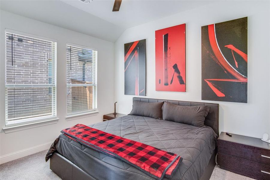 Bedroom featuring carpet and ceiling fan