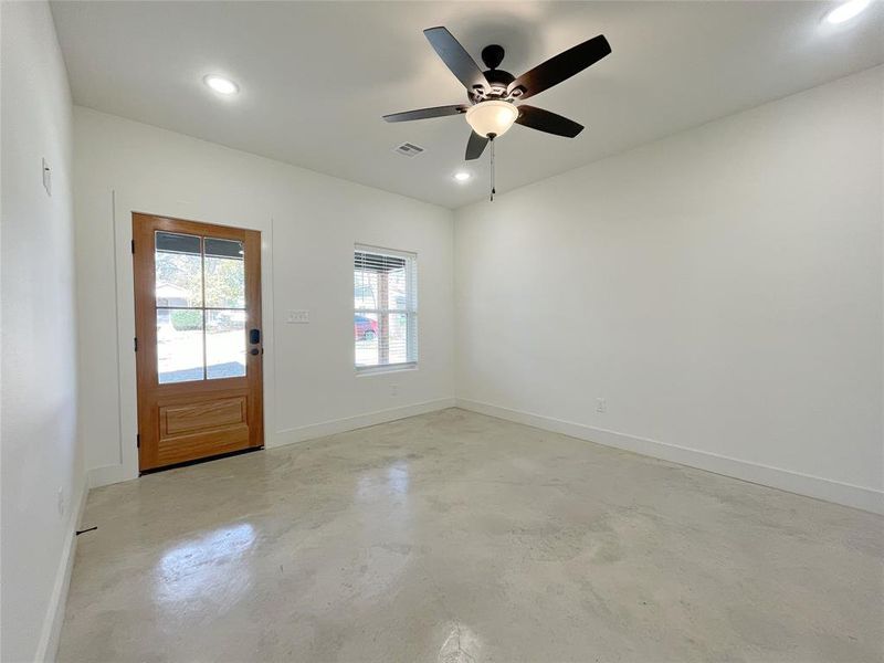 Empty room featuring ceiling fan