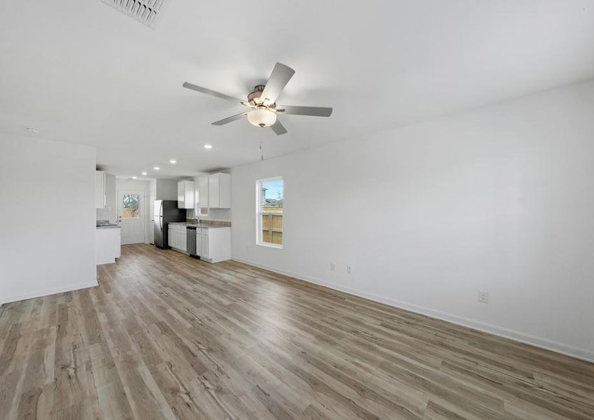 Open concept floor plan where family room leads to the kitchen