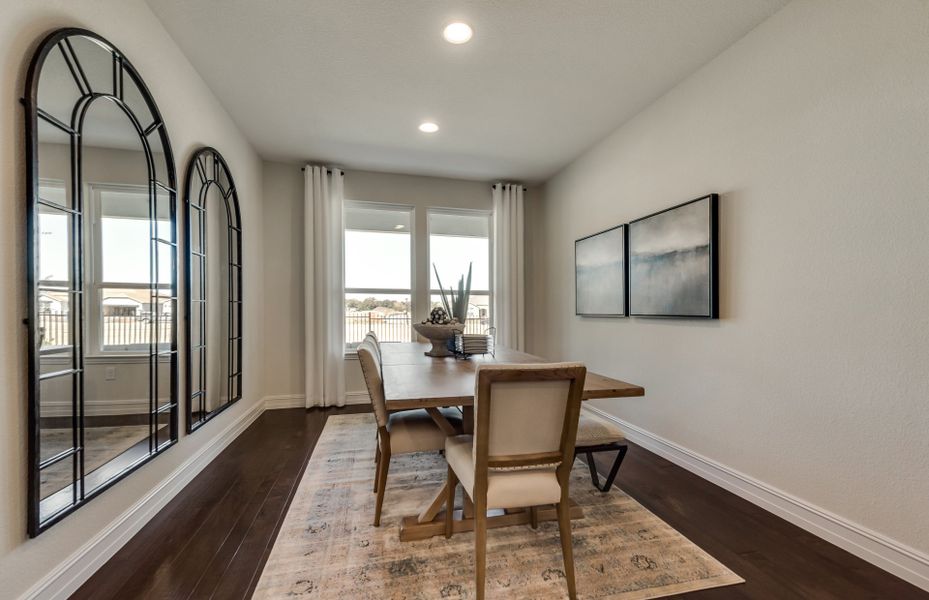 Dining area off kitchen with large window