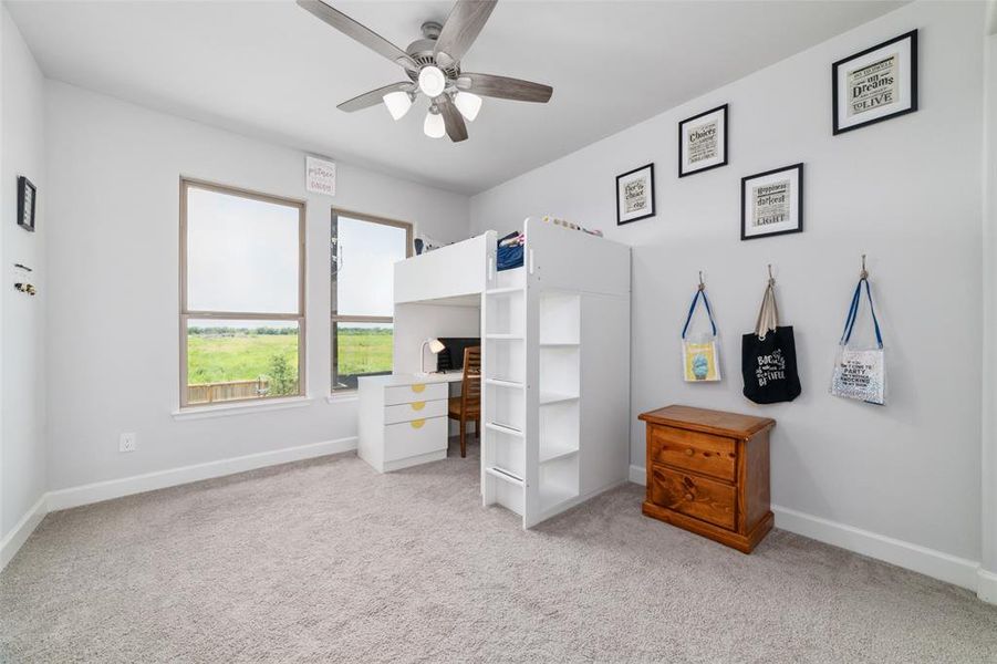 This is the other bedroom connected to the Jack and Jill Bathroom, it has two large windows that provides ample light. This bed can also stay with the home.