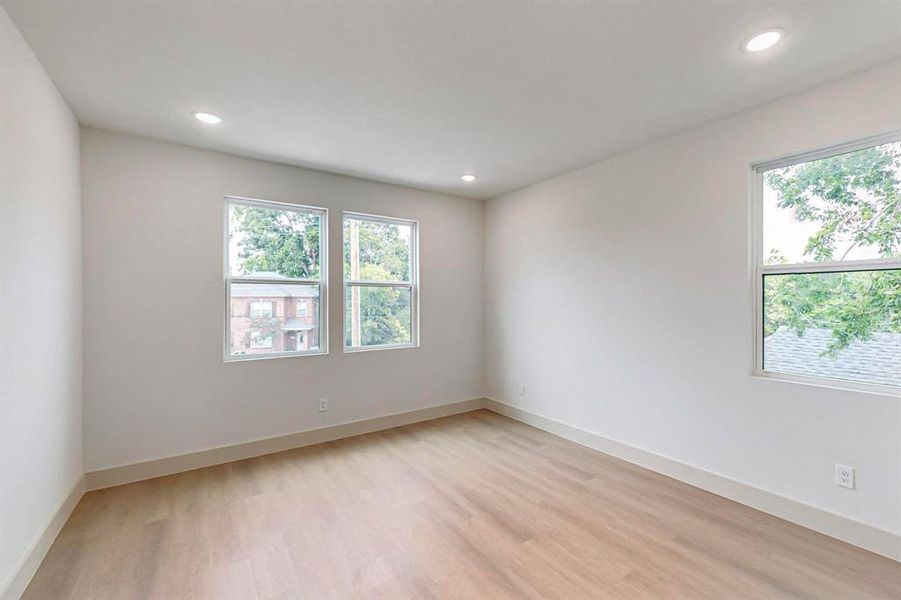 Spare room with light hardwood / wood-style flooring