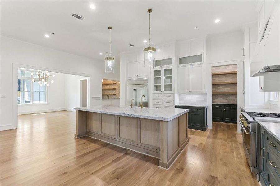 The kitchen in this home is sure to be everyone's favorite room. Visible on the right is the Butler's pantry, which lead's into the main pantry behind the wall.