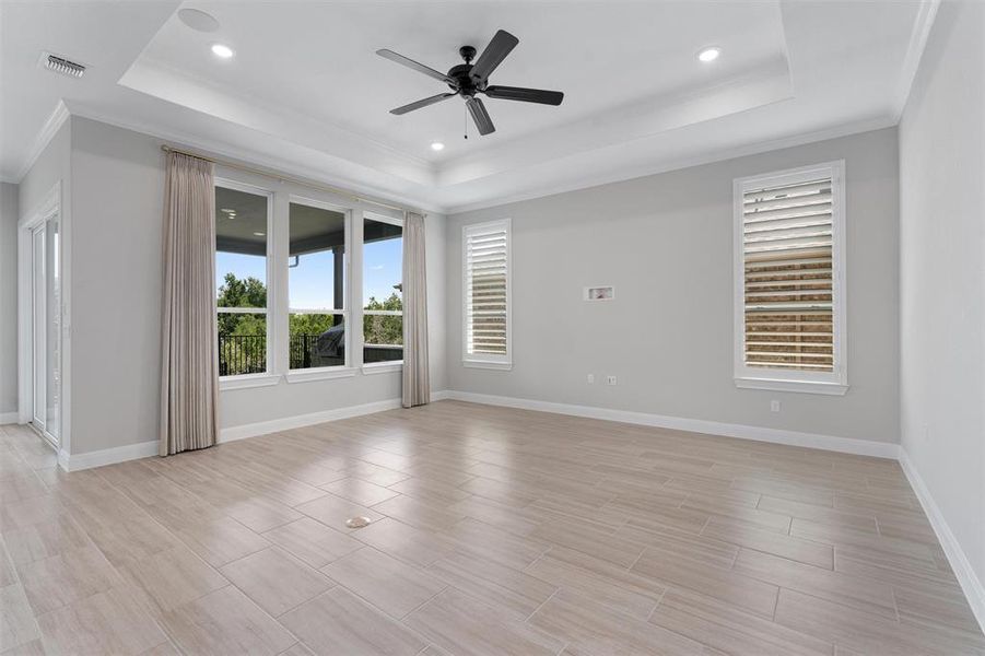 living room w/ large windows, ceiling fan