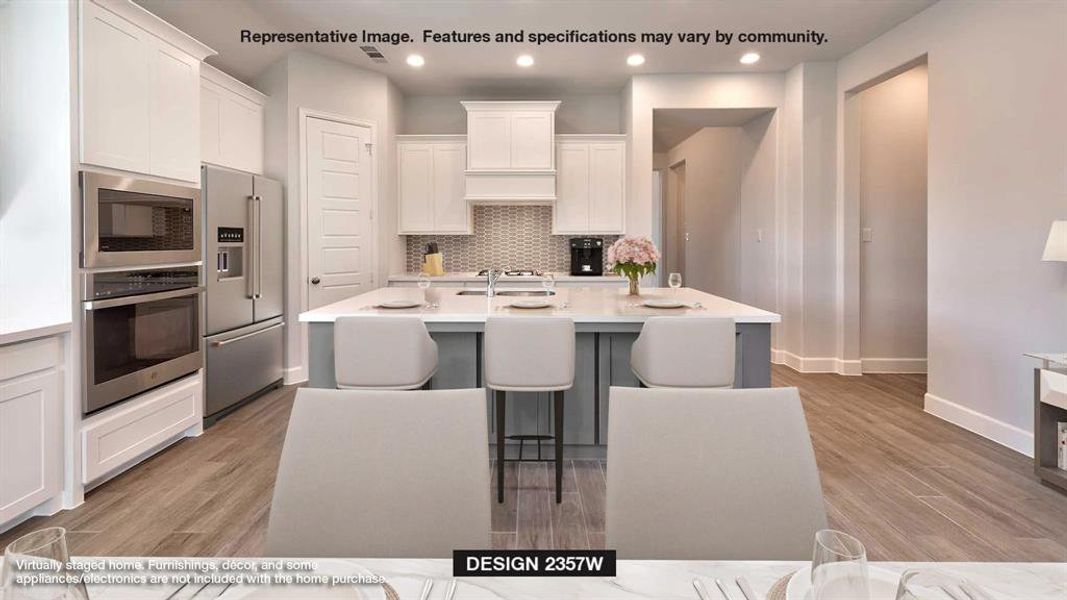 Kitchen with light hardwood / wood-style flooring, white cabinetry, a kitchen island with sink, and stainless steel appliances