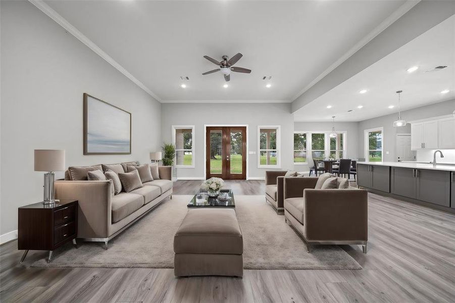 Virtually Staged - Large living area with 12 ft ceilings looking out 8 ft tall Mahogany back doors