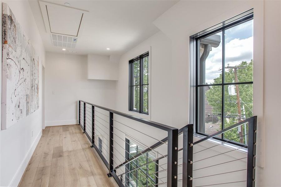 Corridor featuring light hardwood floors