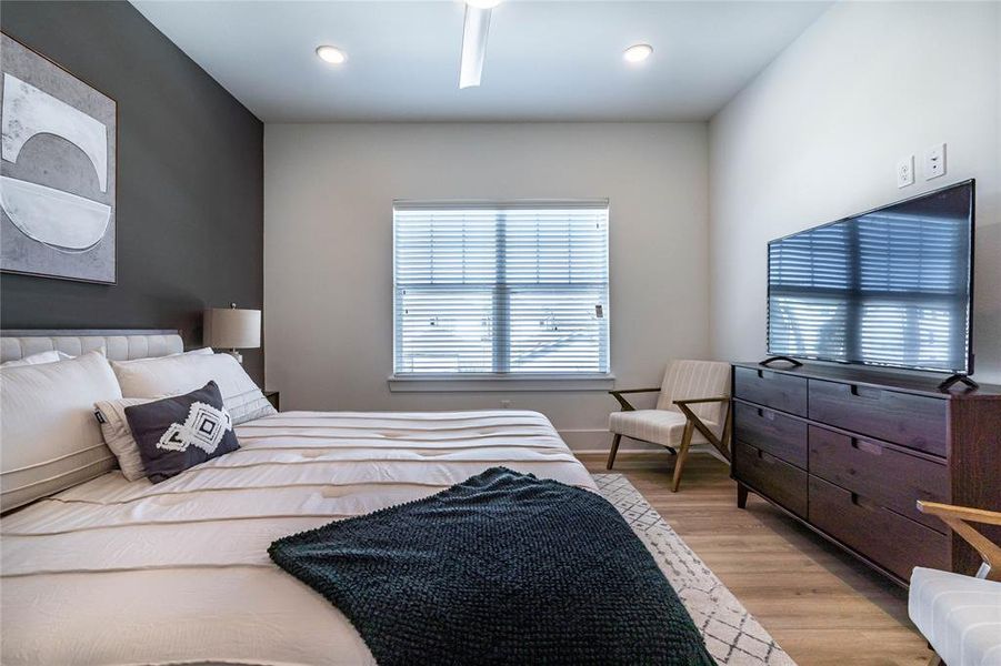 Enjoy abundant natural light and complete privacy in the primary bedroom with no neighbors across the street, creating a serene and tranquil living environment.