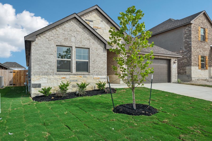 Front exterior of the the FItzhugh floorplan in a Meritage Homes community.