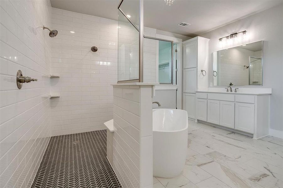 Bathroom with vanity, tile patterned flooring, and separate shower and tub